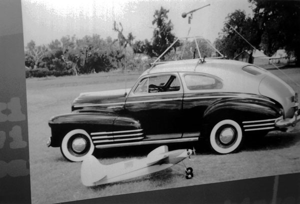  1942 Chevrolet. Model flew on 100-ft line attached to pylon on top of car. 