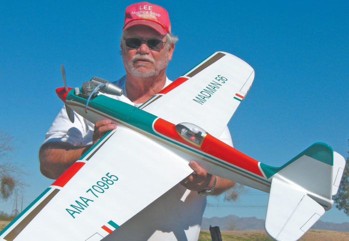 Robin Sizemore, of Tucson AZ, displays his Madman. The designer, J.C. Yates, was also nicknamed Madman for some of his wild stunts while flying his Orwick spark ignition-powered original. Photo by Jim Hoffman.