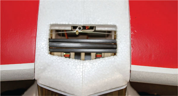 Everything slides into locking position, the wires are routed, and the flap rods are inserted into the servo connector. It’s best to check the elevator and rudder throws before this step for easier access. 