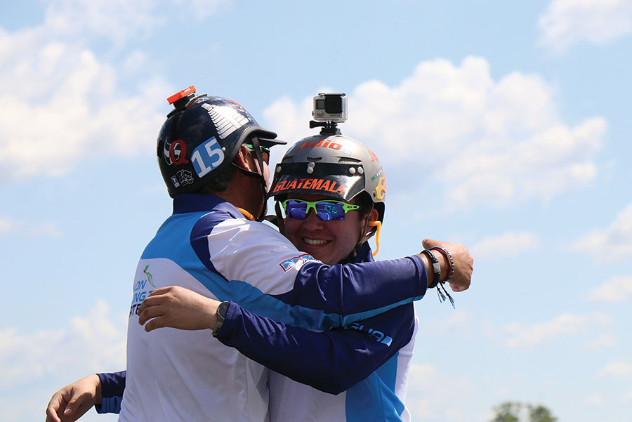 Julio M. Quevedo (L) hugs his son, Julio Q., after finding out they made it to the F3D finals.