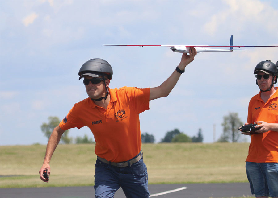 Joris Crevecoeur, of the Netherlands, launches an F3E aircraft for pilot and fellow teammate Peet Doddema. Joris had a smile on his face throughout the contest.