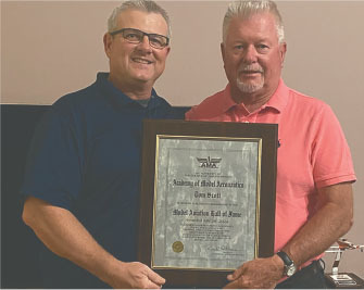 Inductee Tom Scott (R) with his AMA Model Aviation Hall of Fame 2022 plaque. 