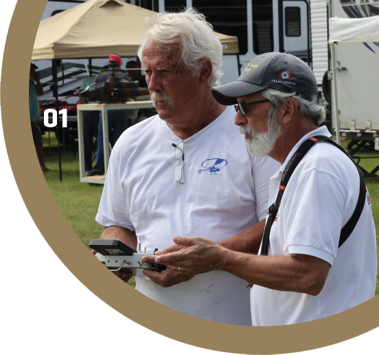 One of the best parts of the Southern Scale Challenge is helping others. Here, CD Darrell Sprayberry (L) gets tips for fine-tuning his bavarianDEMON Axon via the interface available on his JETI radio system. Sandy (R) has also been a judge at the Scale He