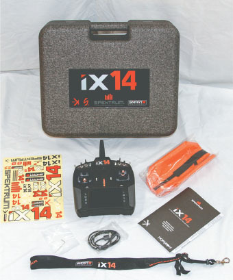 The iX14 arrives in the protective foam case with a neck strap, a quick-start guide, a charge cord, a magnetic adapter, decals, and a radio. 