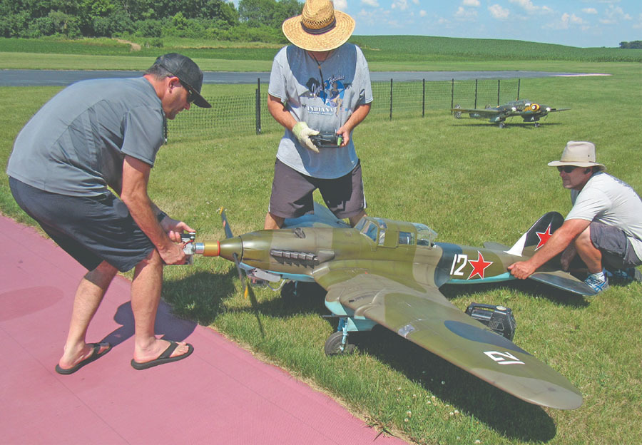 Jeff Quesenberry (middle) is shown with Shane Logue holding the tail and Dave Szabo starting Jeff’s IL-2. 