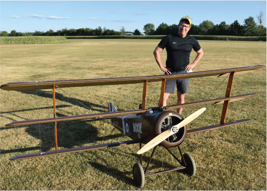 John Elliot, with his 1/3-scale, rotary-powered JW Sopwith Triplane, and the aircraft in flight. 