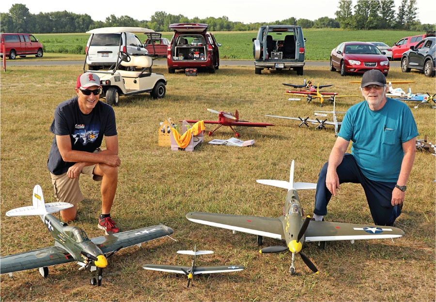  Mike McHenry, with his first-place Fun Scale P-39 and his first-place 1/2A Scale P-39, and Steve Kretschmer, with his first-place Sport Scale P-39. 