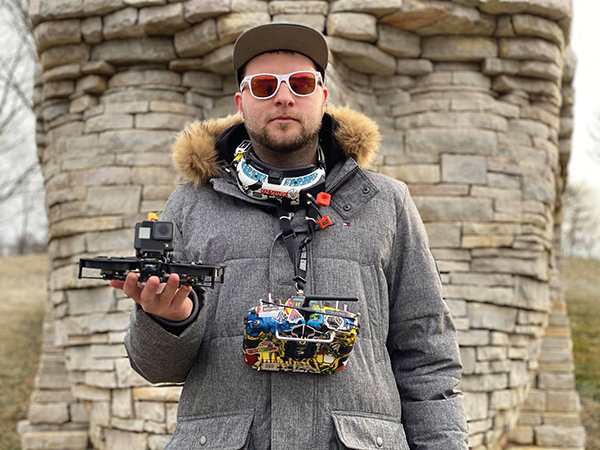 Ryan Hart holding a cinewhoop fpv drone