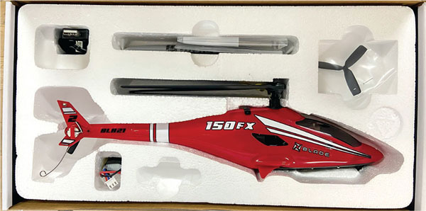 The 150 FX arrives in a foam-fitted box that serves as a case for the helicopter. The transmitter is stored on the back side. 