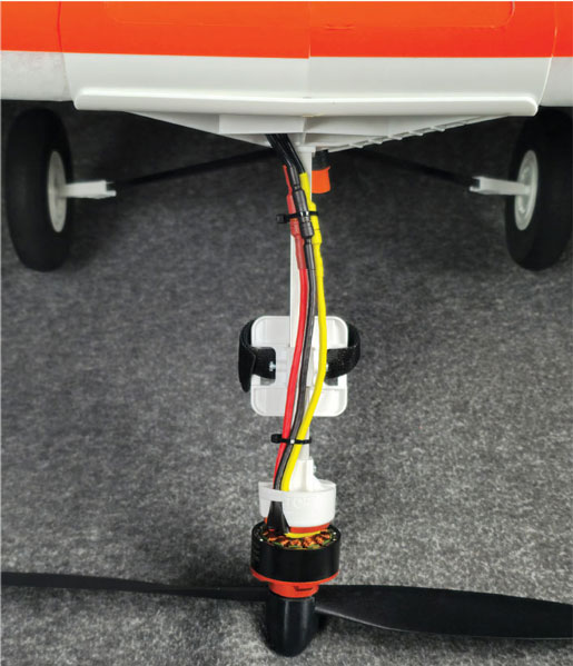 The battery mounts on the bottom side of the tray between the motor mount and the landing gear. A 2,200 mAh battery will take the entire space between the two. 