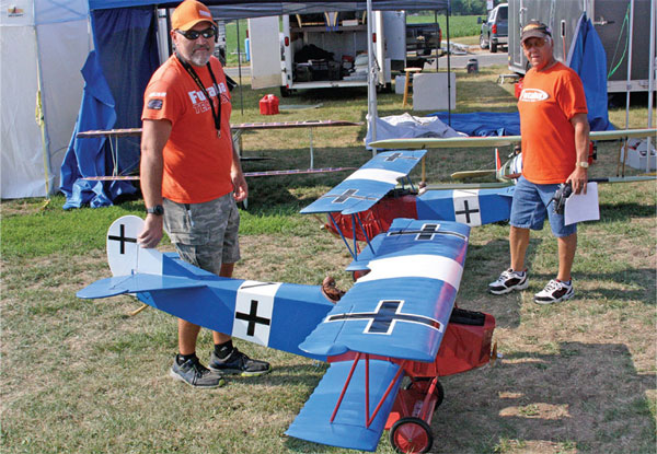 Jeremy Arvin and Al Kretz compare Dale Arvin’s and Al’s identical Balsa USA Fokker D.VIIs. One uses a G-38 gas engine and the other is powered by an O.S. 1.08 two-stroke engine. 