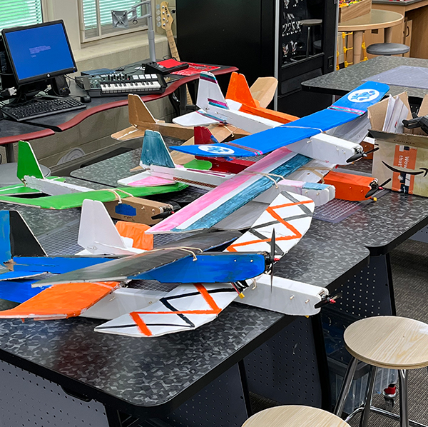 A stack of aircraft waits to be flown by the students who constructed them