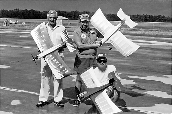 Examples of the El Diablo, which is now a popular Old-Time Stunt model. (L-R) Roy Phillips, Ward Van Duzer, and Mike Starrett hold their airplanes. 