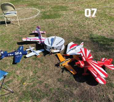 07. This is pure relaxation. The author’s arsenal at his park flyer club recently included a kit-built Bearcat (Ryan Aircraft), an E-flite Pitts, Hacker Edge 540, West Michigan Park Flyers Quasar, a foamie T-6, a foam-board mini Yak, and his self-designed