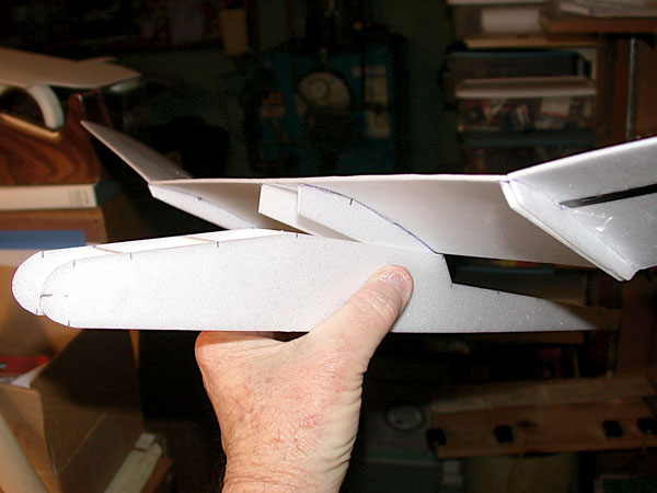 Two center wing ribs fit snugly inside the two fuselage sides. Align the wing with respect to tail surface, set in the proper incidence angle, and apply CA cement. This is an easy process. 