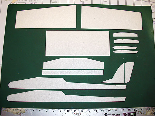 Outlines of the various aircraft parts are transferred to the foam sheet and then cut with an X-Acto knife.