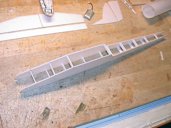 A fuselage assembly fixture was made from 3/16 balsa sheet. It follows the top view of the fuselage. Both Depron foam sides are pinned to this fixture. Partial formers are added above and below the fixture.