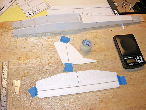 Tail pieces are cut from 2mm Depron sheeting. After spacing the elevator and rudder, hinge tape is pasted in place. Du-Bro Micro Control Horns are used on both control surfaces.