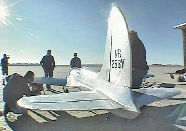 Crew performs final landing-gear check for H-1 before its first test flight.