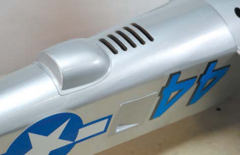Air-cooling vents and scalelike details adorn the fuselage.