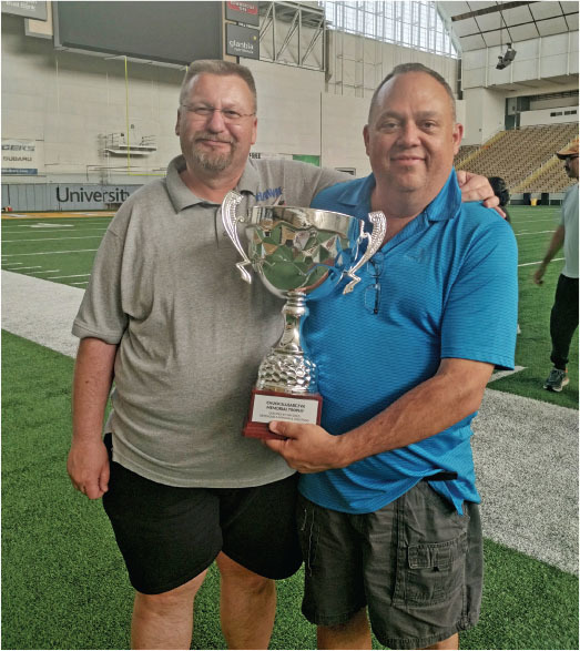 Vladimir (L) and the author (R) hold the Chuck Slusarczyk Memorial USIC No-Cal trophy. There were 18 seconds between first and second places. 