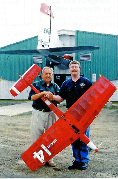 Nelson Sherren (R) serves on the board of the North Atlantic Aviation Museum in Gander, Newfoundland. In appreciation of his help, Maynard donated TAM 23 to the museum.