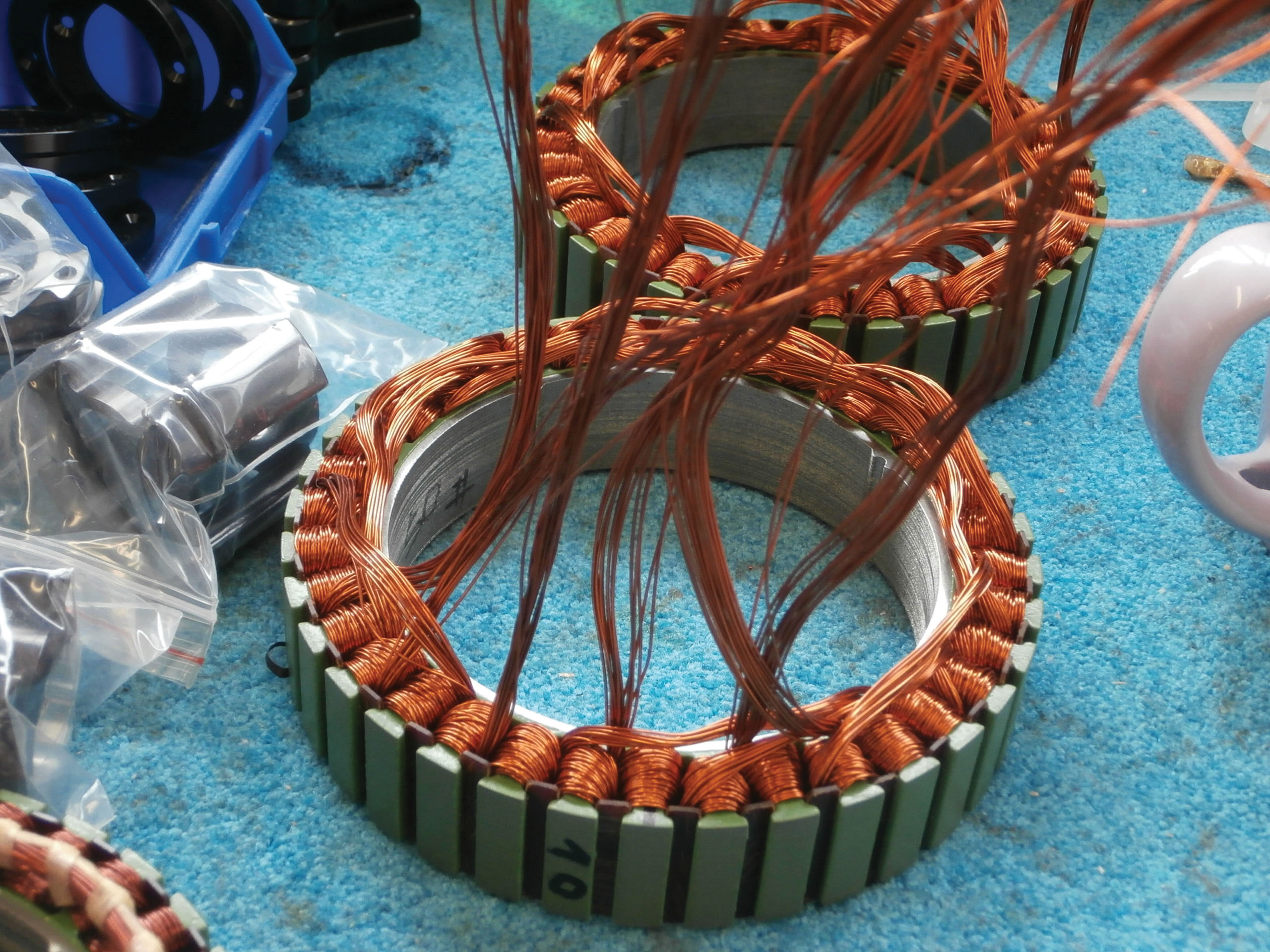 copper wires are wound around the stator to produce magnetic flux