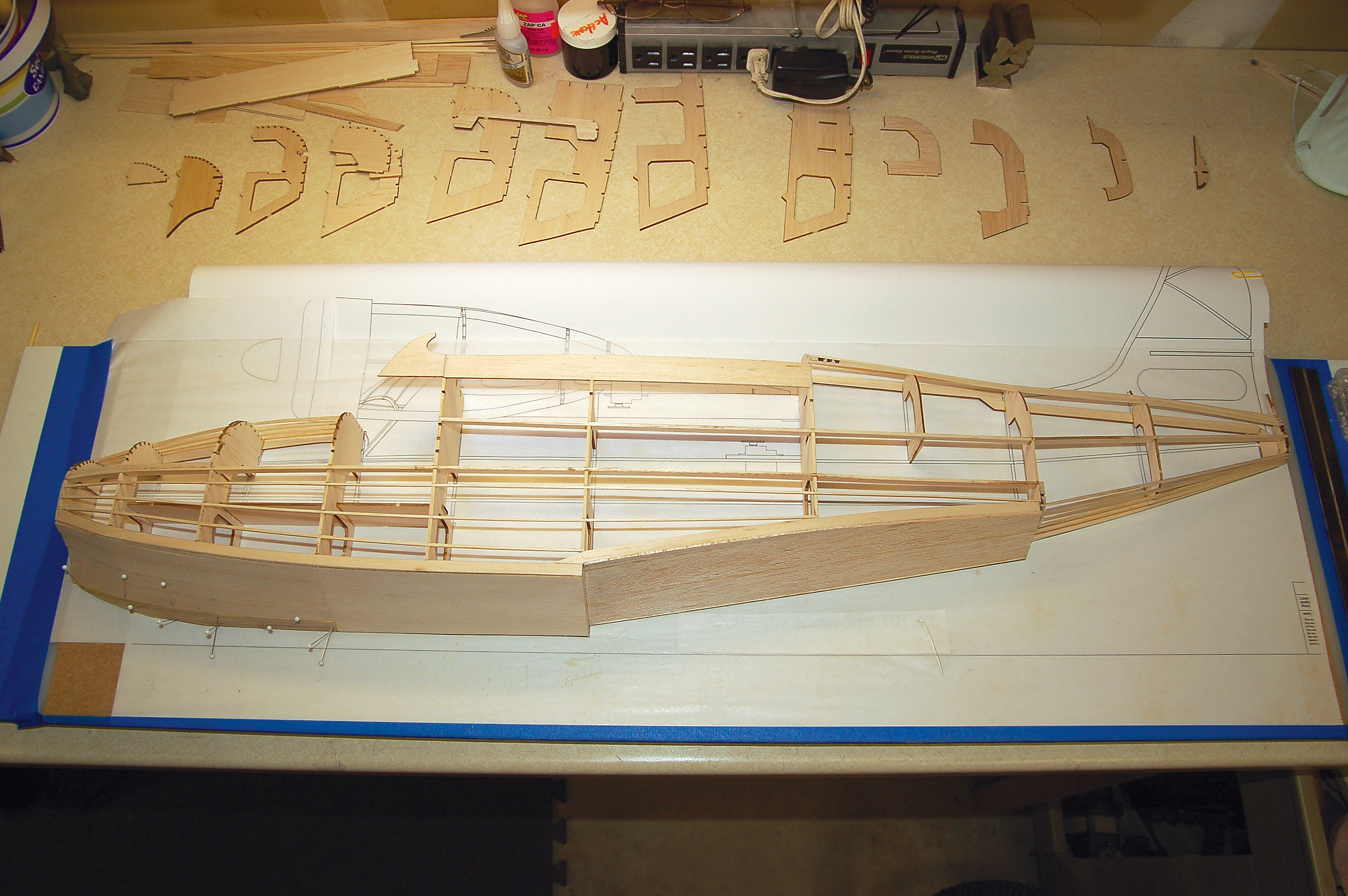 The port side of the fuselage is fi nished. When the sheeting cures the structure becomes extremely rigid.