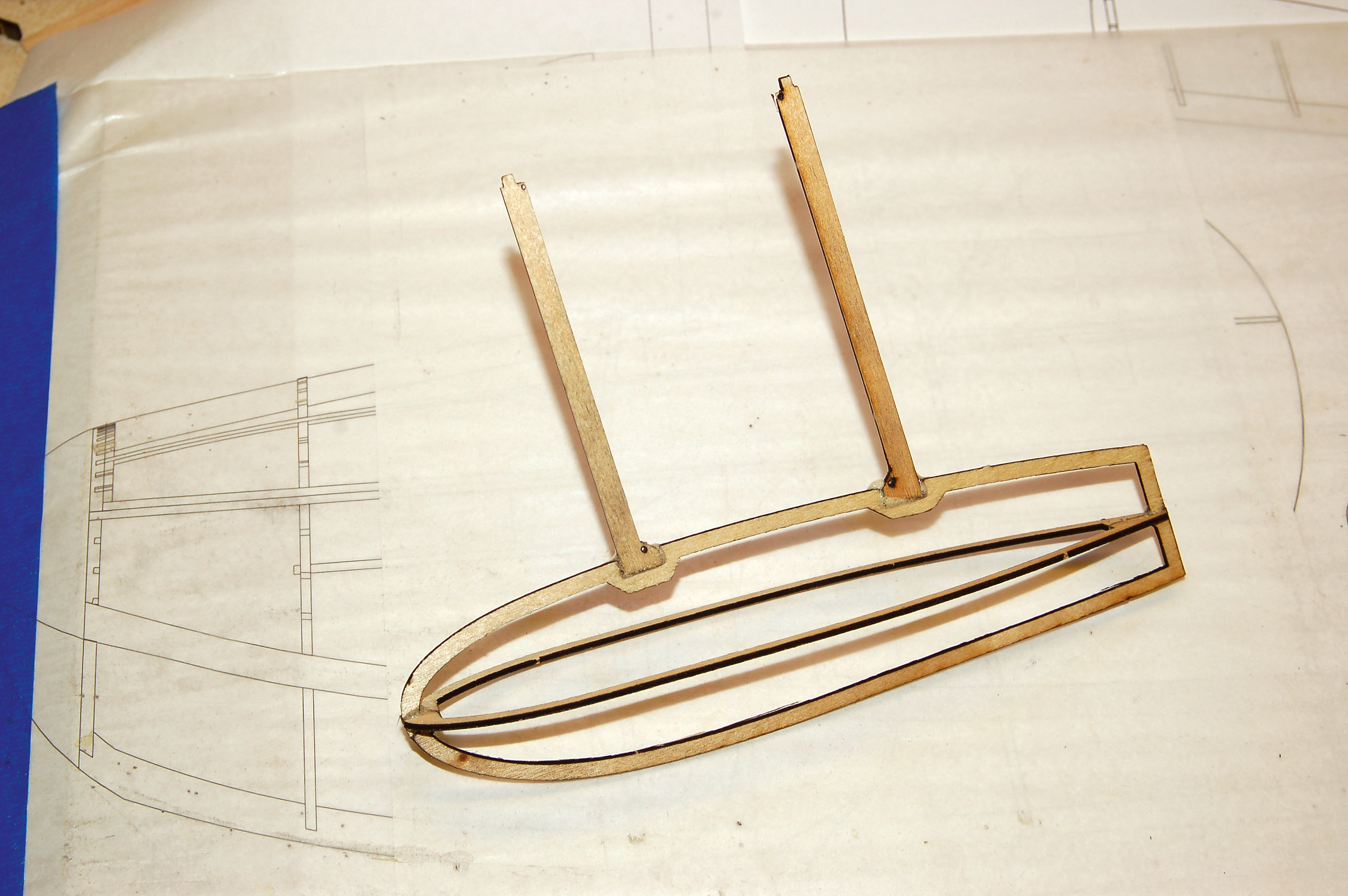The wingtip floats are easy to shape by sanding oversized balsa or foam fi ll down to these scale plywood outlines.