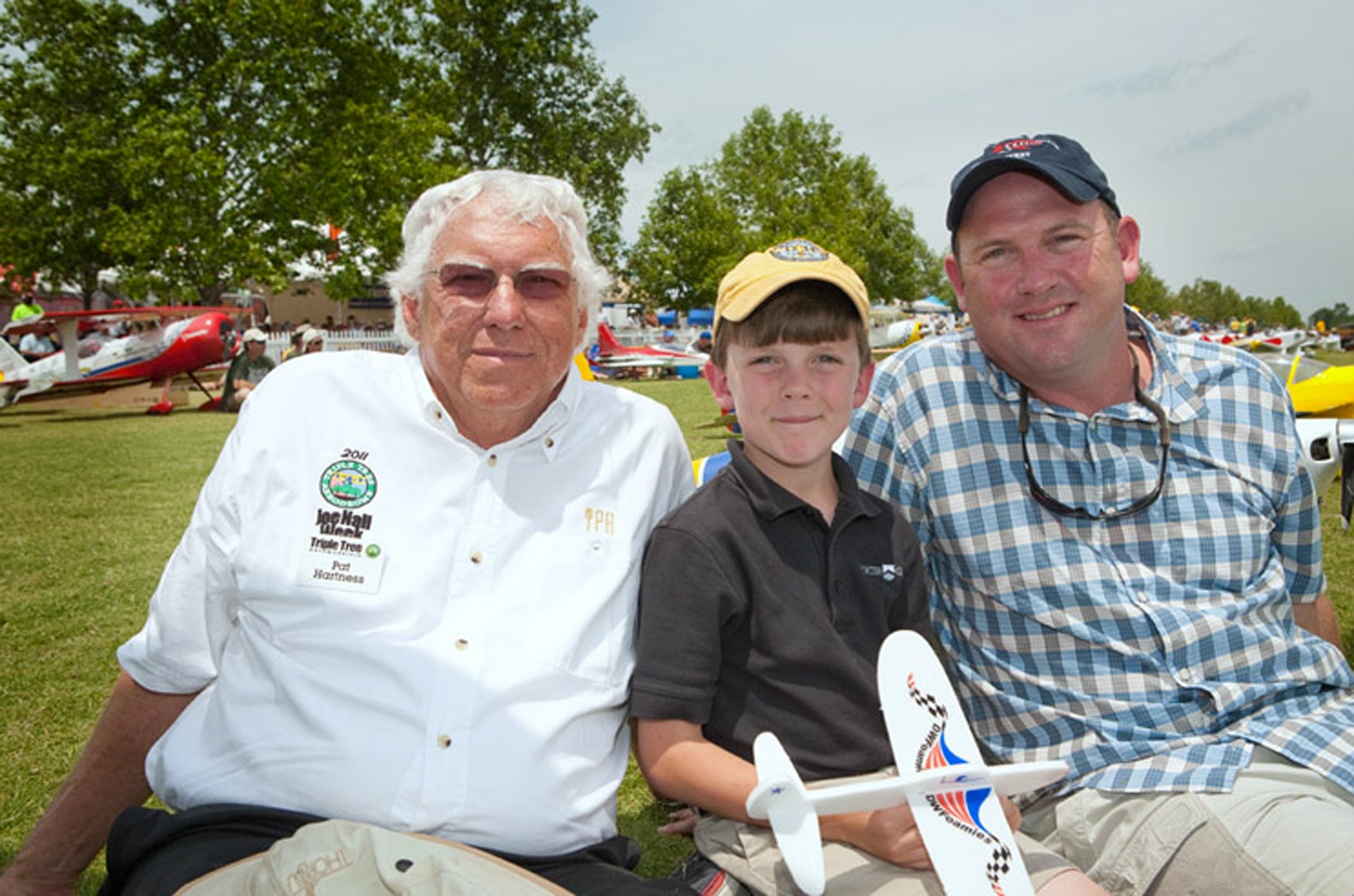 Pat is enjoying his favorite place with two of his favorite people—his son and grandson.