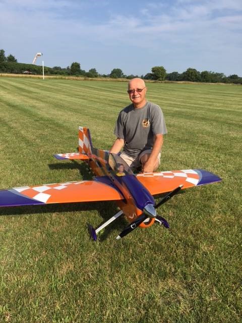 Alain with orange airplane.